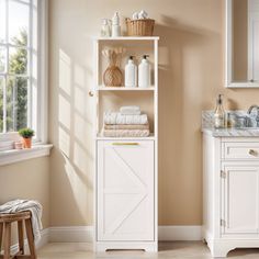 a bathroom with a white cabinet and sink