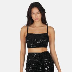 Time to get the party started in this gorgeous and unique SEQUIN Top, made from sequin fabric with adjustable straps and a cropped fit. Pair it with the matching SEQUIN Skirt for a coordinated set, or with jeans and high heels for a stylish look.Size and fit:• The top runs small; we suggest sizing upInfo:• 95% polyester, 5% elastane• Adjustable shoulder straps• Attached draped fabric overlay• Sequin embellishments throughout• Item not sold as a set• Handwash only (no bleaching, dry flat, do not Glitters Skirt, Glitter Top, Workout Crop Top, Black Caviar, Get The Party Started, Neck Crop Top, Sequin Fabric, Running Tops, Draped Fabric