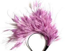 Lilac feather fascinator This lilac feather fascinator is made from high-quality feathers.  A feather fascinator is attached to a black silk-covered metal headband. Feather Fascinator is very stylish and at the same time simple. You can wear it on any occasion like Christening, Weddings, Royal Ascot, or Kentucky Derby races. This piece is timeless. I hope you enjoy it! Kristine xx please have a look at my other fascinators https://www.etsy.com/uk/shop/KristineRosahats?ref=simple-shop-header-name Purple Feather Fascinator For Wedding, Fitted Pink Fascinator With Feather Trim, Elegant Feather Trim Fascinator, Lilac Fascinator, Luxury Purple Feathered Fascinator, Kentucky Derby Fascinator, Derby Fascinator, Feather Fascinators, Metal Headbands