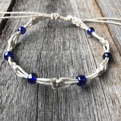 "This lovely boho anklet / bracelet features earth tone color combinations. This hemp anklet was made using 100% natural hemp cord and blue czech beads. Designed for everyday wear. It has an adjustable closure that will fit a 7\" - 7.5\" regular fit wrist. It also opens to around 13 inches to fit as anklet. Please feel free to contact me if you have any questions This bracelet will be shipped by USPS as soon as the payment is been received" Bohemian Waxed Cord Friendship Bracelets With Round Beads, Bohemian Friendship Bracelets With Waxed Cord And Round Beads, Bohemian Beaded Bracelets With Waxed Cord For Festivals, Beach Macrame Friendship Bracelets With Round Beads, Adjustable Natural Beaded Bohemian Bracelets, Bohemian Natural Color Bracelets With Sliding Knot, Adjustable Natural Bohemian Beaded Bracelets, Adjustable Natural Color Bohemian Beaded Bracelets, Spiritual Adjustable Friendship Bracelets For Beach