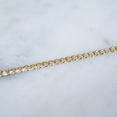 "14k Gold filled Curb Link Bracelet Our new 14k Gold filled Chain and Link Bracelets are a classic addition to your ring collection. If you would like a smaller size than a 6.5\", Please make a comment in the notes section at checkout. Wear one on its own for a simple look or stack with our other gold bracelets! Material: 14k Gold Filled or .925 Sterling Silver" Gift Cuban Link Charm Bracelet With Curb Chain, 14k Gold Filled Yellow Gold Jubilee Chain Bracelet, Minimalist 14k Gold Curb Chain Bracelet, Classic Gold Bracelets With Rolo Chain, Yellow Gold Link Bracelet As Gift, 14k Gold Link Bracelet As Gift, 14k Gold Link Bracelet Gift, Dainty Curb Chain Bracelets For Formal Occasions, Gold Plated Curb Chain Bracelet As Gift