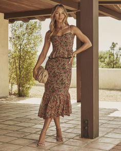 Meet the Simple Hues Floral Print Peplum Midi Dress—your new go-to for fall’s flirtatious flair. Made from lightweight crepe with a hint of metallic shimmer, this dress dances between Western charm and Bohemian whimsy. The lace-trimmed neckline adds a touch of romance, while adjustable shoulder straps ensure a perfect fit. With its peplum silhouette and floral print, it’s effortlessly chic for everything from harvest festivals to cozy autumn evenings. Lightweight crepe fabric with subtle metalli Fall Floral Dresses, Dresses To Wear With Cowboy Boots, Harvest Festivals, Peplum Midi Dress, Fall Floral Dress, Autumn Fits, Bridal Shower Dress, Cozy Autumn, Rose Black