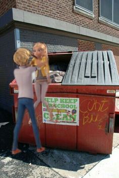 a woman standing next to a red trash can