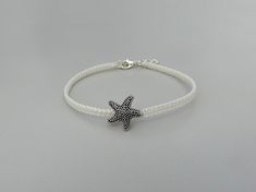 Feel the beach vibes every day with this handmade 7" sea star adjustable friendship macrame bracelet for adults made using strong white nylon cord.  It also has a 1" silver plated extender chain so will fit wrist sizes 7 - 8", ideal if you are buying this as a gift and do not know the exact wrist size of your recipient.  The cute sea star is made of zinc alloy ( which is lead, cadmium and nickel free ). The clasp is silver plated to compliment the white thread.  ★ ALSO INCLUDED ★ Your bracelet will be wrapped in cream tissue paper inside a matching organza bag ready to be given as a gift if required. ★ DELIVERY COSTS★ UK - FREE 2nd class.  USA - international tracked only £3.00 (plus £1.00 per additional item). ★ SHIPPING INFORMATION ★ I  aim to dispatch within 1-3 working days. Your brace White Braided Bracelet With Adjustable Cord, Beach Silver Macrame Jewelry, White Braided Bracelets With Adjustable Length, White Braided Bracelet With Adjustable Length, Summer White Bracelets With Adjustable Length, White Jewelry With Adjustable Cord For Beach, White Adjustable Bracelets For Summer, White Adjustable Friendship Bracelets For Beach, Summer Adjustable Beaded Bracelets With Starfish Charm