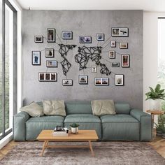 a living room filled with furniture and pictures on the wall