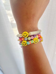 "🙂 Cheerful Color my smile bracelet 🙂 We get it, sometimes there's a lot going on and you just want to keep things simple... That's why this bracelet is perfect for you! With a wide range of colors, you can add a pop of color to any outfit with this simple smiley bracelet The \"Smile\" collection is meant to be for anyone who likes to have fun and be spontaneous! Materials: Disc beads, Smiley face 18K Gold Plated beads, Polymer clay Elastic cord Size: XS: 6.3in or 16cm S: 6.7in or 17 cm M: 7in Trendy Everyday Bracelet With Smiley Face, Trendy Everyday Bracelets With Smiley Face, Trendy Everyday Smiley Face Bracelet, Everyday Beaded Bracelets With Smiley Face, Fun Everyday Bracelet Jewelry, Cute Smiley Face Bracelets For Friendship, Fun White Charm Bracelet For Friendship, White Fun Charm Bracelet For Friendship, Fun Multicolor Everyday Bracelets