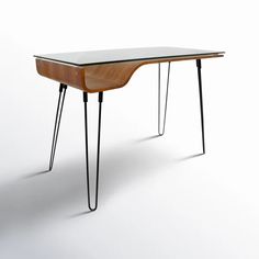 an unusual desk with hairpin legs and a glass top on the table is shown