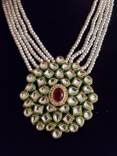 "This is a stunning handmade necklace perfect for high end Jewelry Collector, a keeper in Traditional Vintage Indian/Pakistani Bridal jewelry and a Luxury Gift for your Daughter, Sister or Wife on Wedding or Anniversary. Perfect for any type of occasions, weddings And celebrations and a beautiful & memorable gift for weddings and special occasions. -Pearl Necklace Set with Earrings. -Designer multi layered pearl necklace. -Gold Plated Set with Kundan Stones which shine like Polki Diamonds. - Handmade Round Bridal Necklace For Wedding, Handmade Bridal Necklace For Wedding, Festive Round Pendant Necklace For Wedding, Kundan Jewelry With Pearl Pendant For Celebration, Round Kundan Necklaces For Weddings, Wedding Kundan Necklace With Pearl Pendant For Festivals, Kundan Necklaces For Wedding, Bollywood Style Pearl Pendant Jewelry For Celebration, Temple Jewelry Style Pearl Pendant Necklace For Wedding