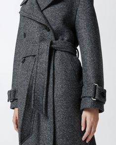 Women's long double-breasted coat made from yarn-dyed wool-blend twill cloth. The silhouette—which includes a lapel collar, long sleeves with cuff tab and matching-fabric waist belt—is inspired by the classic trench coat. Slanted side pockets and double-breasted button fastening. Coat With Belt, Calf Length Skirts, Classic Trench Coat, Wool Trench Coat, Double Breasted Coat, Casual Blazer, Mid Length Dresses, Dress Suits, Outerwear Coats