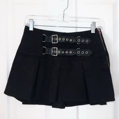 Black Pleated Mini Skirt From Dollskill. The Waist Is 25”. I Really Love It But I’ve Never Worn It, So I May As Well Pass It On. The Buckle Details Are Very Nice. Free People Brandy Melville Dollskill Nordstrom Aritzia Urban Outfitters Uo Women’s Tops Boots Pants Levi’s Mother Paige I Am Gia Low Rise 7 For All Mankind Citizens Of Humanity Revolve Mini Skirt Mini Dress Heels Shoes Hello Kitty Goth Emo Jewelry Punk Lace Leather Jacket Edgy Black Mini Skirt With Belt Loops, Fitted Mini Skirt With Belt Loops For Alternative Fashion, Black Y2k Skirt For Alternative Fashion, Black Punk Skirt For School, Edgy Black Cotton Mini Skirt, Edgy Fitted Mini Skirt With Belt Loops, Black Mini Skirt With Belt Loops For Summer, Punk Fitted Skirt For School, Punk Style Fitted Skirt For School