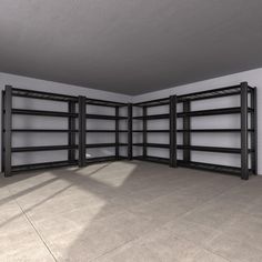 an empty room with several shelving units on the wall and one in the floor