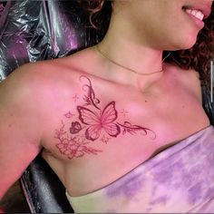 a woman with a butterfly tattoo on her chest