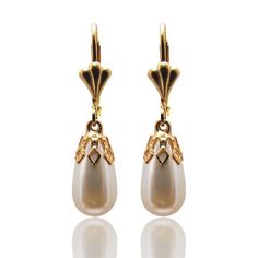 "TearDrop Pearl earrings, vintage inspired for brides or bridesmaids.  Delicate white pearl drop capped with a gold vintage style element. This design has been made with CRYSTALLIZED™ - Swarovski white/ivory Pearls and 24 KT gold plated or silver elements. Earrings length: 0.8\" / 2 cm approx. Complete your look with a Matching necklace: https://www.etsy.com/il-en/listing/129445188/pearl-drop-necklace-gold-plated-and?ref=shop_home_active Follow me on Facebook: https://www.facebook.com/YaelBelDes Elegant Pearl White Dangle Chandelier Earrings, Elegant Pearl Chandelier Earrings, Elegant Pearl White Pearl Chandelier Earrings, Elegant Pearl White Chandelier Earrings With Pearl Drop, Elegant Pearl White Chandelier Earrings, Elegant Chandelier Earrings With Pearl Charm, Classic Pearl Bridal Earrings For Evening, Victorian Teardrop Pearl Drop Earrings, Vintage French Hook Earrings For Wedding