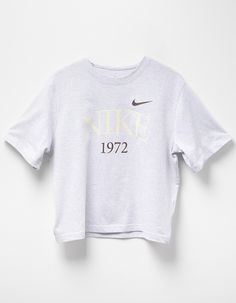 Nike Sportswear Classic Boxy Tee. 1972, The Year We Launched The First Nike Shoe, Serves As A Reminder Of The Past As You Reach Towards The Future. Heavyweight Cotton Gives You A Structured And Premium Feel, While The Boxy Fit And Dropped Shoulder Seams Create A Relaxed Look Without Feeling Too Big. Classic And Timeless—this Tee Does It All. 100% Cotton. Machine Wash. Imported. Nike Retro T-shirt With Letter Print, Retro Nike T-shirt With Letter Print, Sporty Boxy Fit Tops For Sports, Vintage Nike Cotton Tops, Sporty Logo Print Tops For Loungewear, Sporty Cropped T-shirt With Logo For Streetwear, Athleisure Tops With Logo Print For Loungewear, Sporty Letter Print Tops For Loungewear, Boxy Fit Crew Neck Sports Top