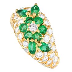 Sparkling diamonds with a total weight of 2.26 carats and emerald gemstones totaling 1.57 carats in a floral pattern make this Graff ring simply spectacular. Crafted from 18K yellow gold, this dazzling ring features a 3mm wide band and a top height measuring 6mm.This jewelry piece is offered in estate condition and includes a gift pouch. Graff Ring, Diamond And Emerald Ring, Contemporary Engagement Rings, Gold Chevron, Bracelet Love, Classic Engagement Rings, Luxury Rings, Yellow Gold Setting, Modern Ring