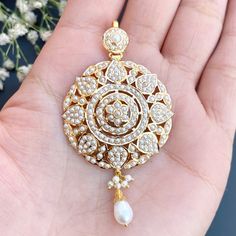 Featuring a floral pendant set embellished with pearls in 22ct gold. It weighs 17.23 GMs including 0.80 GMs in hanging beads. Watch Video Here Pearl Pendant Set, Gold Jewelry Set, 22k Gold Jewelry, Hanging Beads, Gold Jewelry Sets, Floral Pendant, Watch Video, 22k Gold, Pendant Set