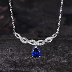 Item description ✦ Handmade, high-quality item! ✦ Material: 925 sterling silver, Solid 14K/18K GOLD (can be made in white/rose/yellow gold), Platinum ✦ Center Stone: 6x8mm Pear Cut Lab Blue Sapphire ✦ Side Stones: Round Cut Moissanites ✦ Chain length can be adjusted between 16 inches and 18 inches As it is handmade, it needs 2-4 weeks to finish and then be shipped by USPS or FedEx. Return policy: We offer 30 days return policy. For any reason, if you are not completely satisfied with your order, you may return it for a refund.  Buyer is responsible for the handcraft fee (15%-30% of the total price) and the return shipping cost. Blue Diamond Gemstone Necklace For Anniversary, Blue Gemstone Diamond Necklace For Anniversary, Blue Sapphire Diamond Necklace As A Gift, Blue Diamond Pendant Necklace For Anniversary, White Gold Sapphire Teardrop Pendant Necklace, White Gold Sapphire Teardrop Necklace, Sapphire Drop Necklace For Anniversary, Sapphire Pear-shaped Necklace For Anniversary, Anniversary Sapphire Pendant Diamond Necklace