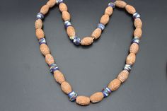 Vintage terracotta ceramic beaded necklace. The beads are carved and are spaced with smaller hand painted beads. The necklace does not have a fastening and just slips over the head. In lovely condition. To note - We do our best to describe things as accurately as possible but please look at all photographs carefully as they form part of the description. Our items are all vintage and will have some wear unless stated.  Postage - we do combine postage. Packaging - your item will come in a little delivery box and will be wrapped carefully inside the box. All packaging is recyclable. We aim to post within 3 working days of payment. Any queries don't hesitate to contact us, always happy to help. Thank you! Traditional Carved Necklaces For Formal Occasions, Antique Brown Carved Jewelry, Vintage Round Polished Beads Jewelry, Antique Single Strand Necklace Gift, Antique Single Strand Necklace As Gift, Antique Single Strand Necklace For Gift, Traditional Oval Ceremonial Necklaces, Traditional Oval Necklaces For Ceremonial Occasions, Traditional Oval Ceremonial Necklace