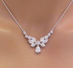 a woman's necklace with diamonds on it