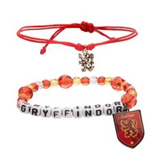 two bracelets with charms and a red ribbon around them that say gryffinfindor