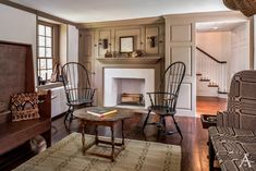 a living room filled with furniture and a fire place