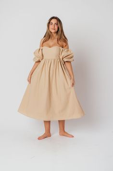 The Hamilton is everything you're looking for in a midi dress - charming, sophisticated, and absolutely flattering. It features premium quality details, like a sweetheart neckline and gorgeous balloon sleeves that can be worn on or off the shoulder. It's an unforgettable choice for every body type, and extra-comfy for expecting mamas! The best part? You can wear this beauty long after your sweet baby arrives! Available in multiple colorways. FIT: Runs true to size. Features a smocked back panel for comfort. This dress is roomy in the waist and will accommodate early maternity in your true size, but consider sizing up if you are in advanced pregnancy. MATERIAL: GARMENT DETAILS: Empire-waisted midi dress, with sweetheart neckline and statement balloon sleeves that can be worn on or off the s Feminine Midi Dress With Sweetheart Neckline For Casual Occasions, Feminine Midi Dress With Sweetheart Neckline For Casual Wear, Knee-length Midi Dress With Gathered Sleeves For Date Night, Puff Sleeve Midi Dress With Fitted Bodice For Brunch, Fitted Bodice Midi Dress With Puff Sleeves For Brunch, Date Night Midi Dress With Gathered Sleeves, Feminine Midi Dress With Gathered Sleeves For Date Night, Chic Fitted Midi Dress With Balloon Sleeves, Flowy Midi Dress With Sweetheart Neckline For Casual Wear