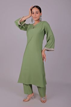 Bluesaanchi Women's Light Green Kurti Pajama Set  The Bluesaanchi Women's Light Green Kurti Pajama Set is a perfect blend of elegance and comfort. This beautifully designed set features a light green kurti paired with matching pajamas, making it an ideal choice for casual outings and festive occasions. The intricate detailing and comfortable fit make this set a must-have addition to your wardrobe.  Key Features  Stylish and elegant design  Comfortable fabric for all-day wear  Perfect for casual and festive occasions  Available in various sizes   Specifications  Brand: Bluesaanchi  Color: Light Green  Set Includes: Kurti and Pajama  Available Sizes: S, M, L, XL   Material & Care  Material: Made from high-quality cotton fabric that is breathable and soft on the skin. Care instructions includ Unstitched Pant Set For Eid Designer Wear, Fitted Straight Kurta Palazzo Set With Dabka, Fitted Dabka Pant Set For Eid, Wedding Pant Set With Dabka On Straight Kurta, Festive Straight Kurta Pant Set With Dabka, Unstitched Anarkali Pant Set For Eid, Eid Straight Kurta Pant Set With Dabka Work, Pista Green Palazzo Set For Navratri, Festive Semi-stitched Pant Set With Straight Kurta