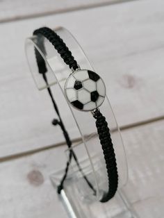 a bracelet with a soccer ball on it