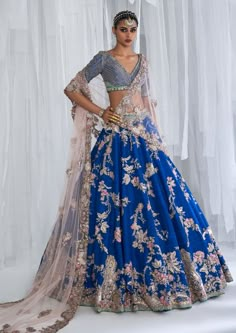 Editor's Note Featuring an firuzeh raw silk bridal lehenga with gota, zardozi and thread embroidery with a pale pink tulle dupatta and an embroidered blouse. Fabric: Raw silk Color: Blue Components: Lehenga, blouse, dupatta Occasion: Wedding Care: Dry Clean Only Customize Your Outfit Can't find the size you're looking for? No stress. Just select the size "Custom" while adding the item to your cart. We will follow up with you for your body measurements. To request a color or design customizations Blue Bridal Lehenga, Lehenga For Engagement, Silk Bridal Lehenga, Dolly J, Baju Kahwin, Blue Lehenga, Bridal Lehengas, Blue Bridal, Amritsar