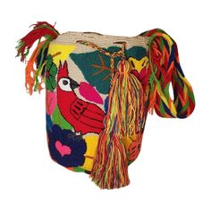 Introducing our exquisite Wayuu Bag, a stunning blend of tradition and contemporary style. Handcrafted by skilled artisans from the indigenous Wayuu community in Colombia and Venezuela, each bag is a masterpiece of intricate weaving and vibrant colors. With a diameter ranging from 9 to 13 inches and a matching depth, this bag strikes the perfect balance between functionality and elegance. Its compact yet spacious design allows you to carry your essentials with ease while adding a touch of unique Traditional Travel Bucket Bag With Removable Pouch, Traditional Multicolor Bag With Removable Pouch, Traditional Multicolor Bags With Removable Pouch, Multicolor Woven Bucket Bag As Gift, Multicolor Woven Bucket Bag Gift, Handmade Multicolor Pouch Bucket Bag, Traditional Multicolor Bucket Bag For Daily Use, Traditional Multicolor Bucket Bag With Adjustable Strap, Bohemian Multicolor Bucket Bag Gift