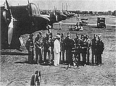 an old black and white photo of people standing in front of airplanes on the ground