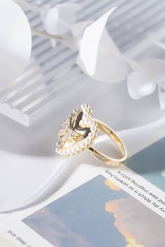 Diameters: 18 mm Weight: 4.4 g Plating Material: 18 Gold Decoration: PearlGold plated on Jewelry brass/silverDelivered in Zinfu Fine Jewelry Package. Elegant Open Butterfly Metal Ring, Elegant Open Butterfly Ring, Gold Crystal Open Ring For Valentine's Day, White Gold Plated Open Ring, Butterfly-shaped Open Metal Ring For Wedding, Elegant Flower Open Ring For Valentine's Day, Elegant Open Flower Ring For Valentine's Day, Gold Plated Pearl Ring For Wedding, White Open Butterfly Ring For Wedding