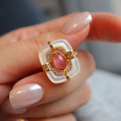 "Mid-Century Style Tourmaline Ring, Natural Pink Tourmaline Engagement Ring, Vintage Wedding Bridal Ring for Women, Pink Gemstone Ring, Gifts Material: 925 Sterling Silver with Gold Plated Gemstone: Natural Pink Tourmaline, Mother of Pearl & CZ Ring Size: Adjustable for US 4 to US 9 Don't forget to find more designs from our shop: https://www.etsy.com/hk-en/shop/NikiFashionJewelry Be sure to hit \"favorite\" on the right so it remains in your favorites list and/ or add to your wish list(s). Hope Elegant White Crystal Ring With Gemstone Accents, Elegant Wedding Birthstone Ring With Stones, White Multi-stone Elegant Crystal Ring, Pink Enamel Round Ring For Wedding, Pink Round Enamel Ring For Wedding, Ruby Open Ring With Stone Setting For Wedding, Pink Round Enamel Wedding Ring, Exquisite Ruby Ring With Gemstone Accents For Wedding, Elegant White Multi-stone Crystal Ring