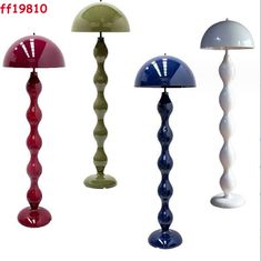 four different colored lamps are shown in this image