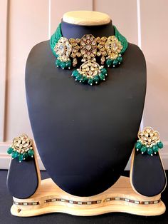 Premium Quality Polki Chokar Style Necklace with Monalisa Beads. Item : Necklace with earring Color : Gold Polish, Bottle Green Color Length of the Beads including centerpiece - 9 1/2 inches (The length does not include the adjustment tie) Length of Centerpiece : 4 inches Width of Centerpiece : 3 inches Length of Earrings : 1.7 inches Width of Earnings - 1.5 inches Shop Polices - - Final Sale, No Return, No exchange - All are jewelry is handmade hence there is little inconsistency or small marks due to handmaking. These are not considered as defects however it is sign its handmade. No return or exchange requests will be accepted due to any such reasons. - Please note Jewelry is delicate and Fragile, please handle with care. - There can be little variation in the color due to screen resolut Kundan Beaded Choker For Parties, Beaded Kundan Jewelry Sets For Party, Embellished Jewelry With Round Beads For Gifts, Embellished Round Beads Jewelry Gift, Gift Jewelry With Embellished Round Beads, Festive Crystal Necklaces For Reception, Party Kundan Necklace With Crystal Stone Work, Crystal Kundan Necklace With Stone Work For Party, Festive Celebration Kundan Necklace With Crystal