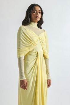 Butter yellow malai lycra and net draped dress with pleated detailing. - Aza Fashions Summer Dresses With Draped Sleeves Traditional Drape, Traditional Drape Evening Dresses For Spring, Spring Evening Dress With Traditional Drape, Fitted Pre-draped Skirt For Festive Occasions, Festive Dress With Draped Cape Sleeves, Festive Dresses With Draped Cape Sleeves, Pleated Fitted Draped Skirt For Party, Fitted Pleated Draped Skirt For Party, Fitted Pre-draped Skirt For Gala