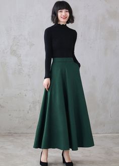 "This winter wool skirt is a classic piece of tailoring that will see you through rain or shine. It is cut with a flattering flared skirt to give you a wonderful shape. The winter skirt is perfect classic styling and ends at the ankle. This is a versatile skirt that you'll wear again and again. DETAILS: * More colors available https://etsy.me/3kURa6k * 30% wool, 30% fiber, 40% polyester * fully satiny liner * Two side pockets * Right zip closure * A little Back elastic, comfortable wear * Plus s Green Fitted A-line Maxi Skirt, Winter Full Length Solid Skirt, Winter Full-length Solid Skirt, Winter Full-length Pleated Skirt, Fitted A-line Skirt For Winter, Winter Flared Green Skirt, Winter Green Flared Skirt, Winter Full Length Lined Skirt, Winter Maxi Skirt For Workwear