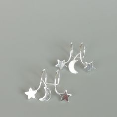 Sterling silver ear cuff and wrap earring.Comes with a crescent moon and stars. This listing is for ONE PAIR Size: 15 x 19 mm Stars: 5x 5mm Crescent moon: 6 x 5mm Weight: 0.90gm These earrings are made of real 925 hypoallergenic sterling silver. All my pieces are sent in a gift box. I can include a personal message from you if needed You are welcome to contact me at... bhavnakwintra1956@gmail.com For more beautiful pieces from my shop, please browse 👇 TOE RINGS: https://www.etsy.com/your/shops/ Silver Star-shaped Ear Cuff As Gift, Silver Star Shaped Ear Cuff As Gift, Silver Star Shaped Ear Cuff Gift, Silver Star-shaped Ear Cuff For Gift, Silver Celestial Cartilage Earrings Nickel Free, Silver Celestial Cartilage Earrings Nickel-free, Celestial Silver Nickel-free Cartilage Earrings, Celestial Silver Cartilage Earrings, Silver Strand