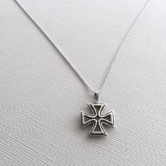 A beautiful Maltese Cross pendant in 925 sterling silver. This hand crafted cross is double sided and hangs from a beautiful, dainty chain. The entire necklace is made of 925 sterling silver with an antique finish to bring out the detailing and shine. This necklace is Nickel-Free and hypoallergenic. Material: 925 Sterling Silver Pendant Size: about 1 inch Chain Length: 16 inches *All purchases will arrive in a gift box! *Available in silver and in bronze *All orders are shipped via USPS First Cl Handmade White Gold Cross Necklace, Classic Necklaces With Silver Chain And Cross Pendant, Sterling Silver White Gold Cross Pendant Necklace, Sterling Silver Pendant Cross Necklace In White Gold, Classic Necklace With Silver Chain And Cross Pendant, White Gold Sterling Silver Cross Pendant Necklace, Classic Sterling Silver Pendant Cross Necklace, Classic Sterling Silver Cross Pendant Necklace, Classic Silver Cross Pendant Necklace