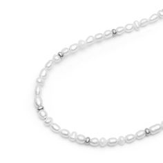 Strung by hand on a strong metal wire in our LA studio, this necklace with white pearls and silver beads will add a unique touch to all your looks. Wear this elegant piece solo or layered. We use cultured white pearls from oysters and freshwater mussels that we select by hand for all our jewelry. Approximate pearl size 4mm. Preserve the elegance of your jewelry by avoiding direct contact with perfumes, body lotions, hairspray, and other chemicals. Always remove your jewelry before going to bed, bathing, showering, swimming, or engaging in physical activities like cleaning or gardening. Protect your pieces from extreme temperatures and humidity, and ensure they are not exposed to direct sunlight. After each use, clean your jewelry with a soft cloth and store it in an airtight jewelry box to Freshwater Mussels, Mens Jewelry Necklace, Forever Jewelry, Body Lotions, Ring Watch, Jewelry Ring Box, Pearl Choker, Metal Wire, Pearl Size