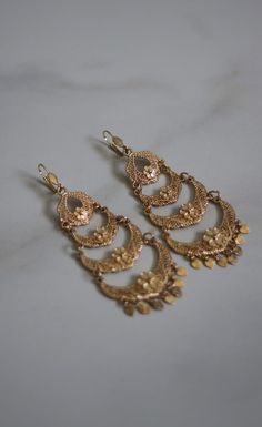 chandelier style earrings Metal Chandbali Chandelier Earrings For Party, Elegant Metal Chandbali Chandelier Earrings, Elegant Chandbali Metal Chandelier Earrings, Ornate Metal Chandelier Earrings For Festive Occasions, Festive Pierced Chandelier Drop Earrings, Festive Chandelier Drop Earrings, Festive Metal Drop Chandelier Earrings, Ornate Chandelier Earrings With Ear Wire, Gold Chandbali Chandelier Earrings With Dangling Beads