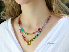 This colorful necklace features breathtakingly gorgeous precious gemstones in a rainbow color palette! Signature Valltasy necklace design. Here I have wire wrapped the most stunning, clear, AAA quality gemstones, in different, fancy, rare shapes. Incredible, one of a kind gemstones – each one is a small perfection! Just look at the amazing Swiss Blue Topaz [...] Colorful Beaded Elegant Jewelry, Elegant Rainbow Jewelry With Gemstone Accents, Elegant Multicolor Crystal Necklaces For Gifts, Elegant Handmade Colorful Necklaces, Elegant Colorful Handmade Necklace, Rainbow Gemstone Accents Jewelry For Jewelry Making, Handmade Elegant Rainbow Gemstones, Elegant Handmade Rainbow Gemstones, Elegant Rainbow Necklaces With Gemstone Accents