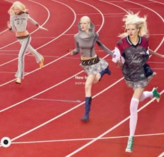 three women are running on a track in the middle of two different outfits and one is wearing knee high boots