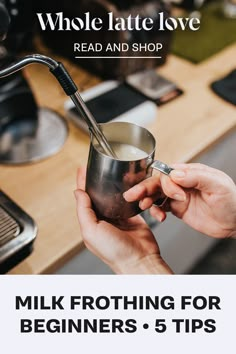 a person holding a metal cup with a straw in it