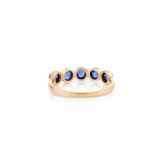 This is part of Chairish’s Fine Jewelry assortment.  Blue Sapphire Bezel Set Band Stacking Ring in 14K Gold symbolizes the everlasting love between a couple. It shows the infinite love you have for your partner. The round shape represents love which will continue and makes your promises stay forever. Sapphire stimulate concentration and reduces stress. Lightweight and gorgeous, this is a perfect blue sapphire band. It can be a Bridal Shower Gift, Valentine's Gift, Gift For Sister, Mother Daughte Luxury Rings With Smooth Bezel For Anniversary, Elegant Sapphire Promise Ring With Bezel Setting, Elegant Sapphire Ring With Bezel Setting For Promise, Timeless Anniversary Ring With Bezel Setting, Promise Jewelry With Bezel Setting In Round Band, Anniversary Stackable Rings In 14k Gold With Bezel Setting, 14k Gold Stackable Rings With Bezel Setting For Anniversary, Anniversary 14k Gold Stackable Rings With Bezel Setting, Oval Sapphire Ring With Bezel Setting For Promise