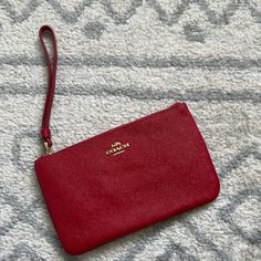 Red Coach Wristlet W/Tags Red Wristlet For Everyday Use, Red Everyday Use Wristlet, Red Wristlet Clutch With Removable Pouch, Red Travel Wristlet With Wrist Strap, Red Clutch Wristlet With Zipper, Red Clutch Wristlet With Zipper Closure, Red Zipper Pouch Wristlet For Gift, Red Clutch Wristlet For Daily Use, Red Wristlet Clutch For Daily Use