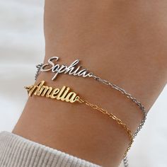 This beautiful bracelet features a custom name charm made from silver and 18k gold PVD plated stainless steel and 9 different chain types to choose from. Available in lengths of 6 to 8 inches. A lovely gift or a special treat for yourself! Font type in photos: Amelia: Font 2 Sophia: Font 1 Material: Stainless Steel Chain Types: Figaro                         Rolo (2mm)                         Medium Paperclip (3.5x12mm)                         Curb (2 mm)                         Satellite                          Sequin                         Cable Finish: 18k Gold PVD Plated Length:6", 7", 8" and comes with an extra 2" extender Browse our wide range of jewelry collection online:  https://www.etsy.com/shop/LeylaMDesignStudio ♥ PACKAGING ♥ All our jewelry come in an eco-friendly package wi Customized Adjustable Stainless Steel Bracelets, Custom Name Adjustable Metal Jewelry, Adjustable Custom Name Metal Jewelry, Customizable Modern Nameplate Jewelry, Modern Customizable Nameplate Jewelry, Custom Name Adjustable Stainless Steel Bracelets, Personalized Adjustable Metal Name Bracelet, Customized Stainless Steel Charm Bracelet, Signature Gold Bracelet With Engraving