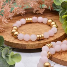 Dreamy rose quartz and golden wood beads make up our newest gemstone bracelet! The gorgeous pale pink rose quartz gemstones in this bracelet are matte and perfectly contrast the super shiny golden wood beads in this design. Rose Quartz is said to be a fantastic stone to wear for promoting self-love, fostering positive relationships, and attracting love and compassion. Get this bracelet for yourself or for a friend and adorn yourself with Dreamy Rose Quartz! Rose Quartz is a form of quartz that i Gold Beaded Bracelets With Rose Quartz, Gold Rose Quartz Beaded Bracelets, Gold Beaded Bracelets With Rose Quartz Round Beads, Gold Beaded Bracelet With Rose Quartz Round Beads, Gold Rose Quartz Beaded Bracelets With Round Beads, Spiritual Gold Beaded Rose Quartz Bracelets, Attracting Love, Pale Pink Roses, Bracelet Size Chart