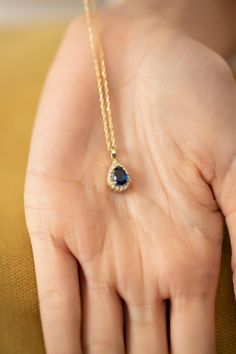 This glamorous and genuine teardrop sapphire sits on a simple, dainty chain. This simple necklace is perfect for everyday wear and evening events. It is also a perfect piece for layering necklaces. You are sure to stand out in this beautiful necklace! :)     Hypo-allergenic, lightweight and minimalist.  That jewelry would make a perfect gift for the woman 💖🎁 💫Listing is for a teardrop Sapphire necklace. 💎Made with 925 Sterling Silver, plated with 14k Gold and the Sapphire gem stone and Zirco Gold Teardrop Sapphire Necklace, Pear Shaped Sapphire Necklace For Gift, Pear Shaped Sapphire Necklace As Gift, Pear-shaped Sapphire Necklace Gift, Sapphire Teardrop Pendant Necklace Gift, Sapphire Teardrop Necklace For Gift, Teardrop Sapphire Birthstone Necklace, 14k Gold Teardrop Birthstone Necklace, Gold Sapphire Necklace