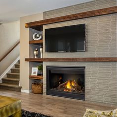 a fireplace with a flat screen tv above it